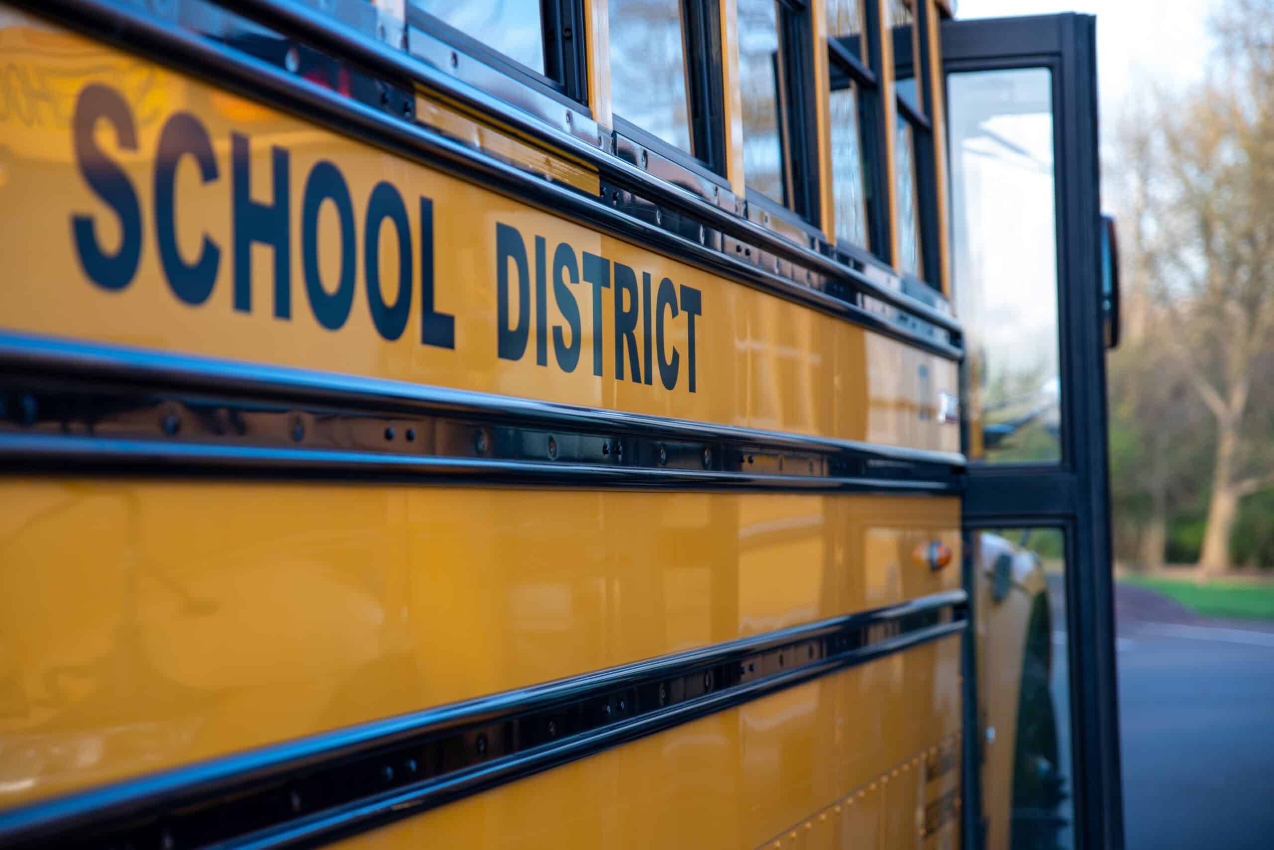 school bus with school district written on the side